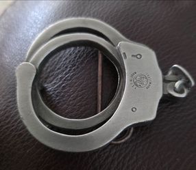 This is a vintage Bergamot Brass Works Handcuff Belt Buckle (Model X-60) from 1981