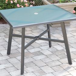 Hanover all-weather commercial-grade aluminum 38” square glass-top dining table