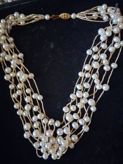 Pearl necklace, earrings, belt. Hair accessories