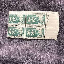 a block of four 4-cent "Dental Health" postage stamps issued by the United States Postal Service in 1959. 