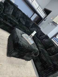 Black sectional sofa with ottoman