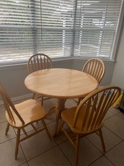 kitchen table with 4 chairs and tv stand.