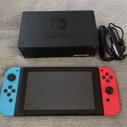 Nintendo switch with charger and extra joycon