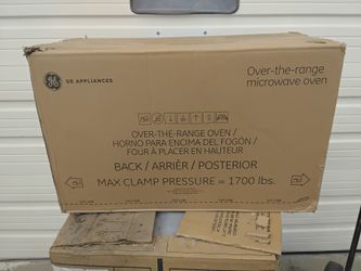 Brand New White GE Microwave Oven Over The Stove Type With Light & Fan.