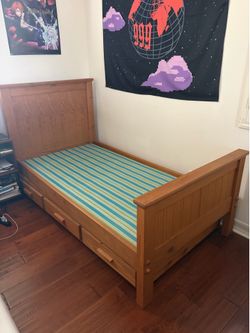 Twin bed frame with rollout trundle
