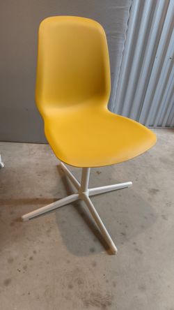 Yellow and White IKEA swivel chair