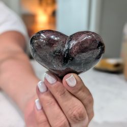 Polished heart-shaped Garnet crystal stone. Decorative healing collectable