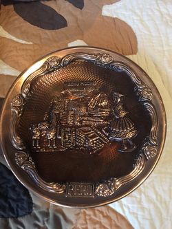Two Peruvian metal wall plates