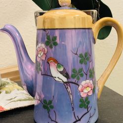 Beautiful Tea Pot Lavender Backing With The Beautiful Flowers On Branches With Th Cute Bird Stands About 8” Tall