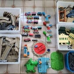 4 Boxes Of Trains, Tracks, & Accessories 