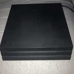 ps4 pro with two controllers & 4 games (Pickup only)