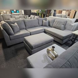 Gray Reversible sectional sofa with ottoman