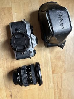 Nikon FG-20 with 50 mm pancake lens and case (and bonus Tokina tele)