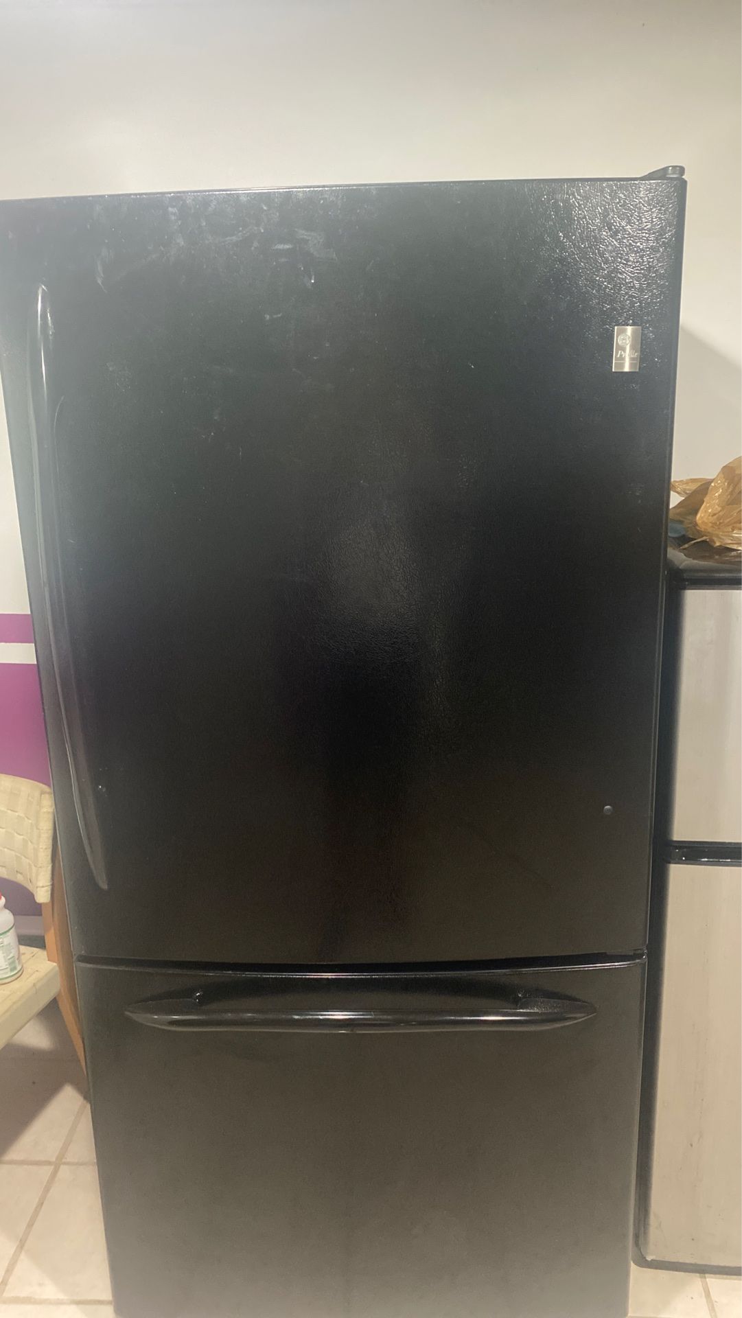 tall refrigerator measures 68 1/8 from front to back 33 and side 31 in good condition