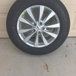 Brand New 235/65R18 106H Tire And Nissan Rim From A 2020 Nissan pathfinder