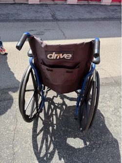 Black and blue Drive wheel chair w/attachments