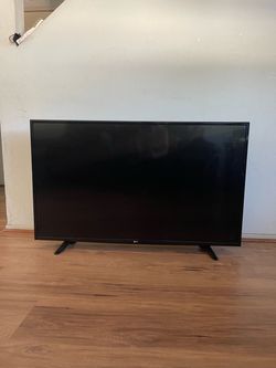 MOVING SALE - used LG Flat Screen TV with Stand