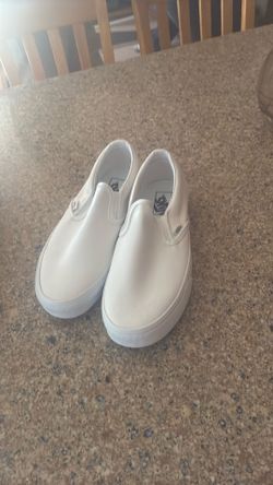 white slip on vans