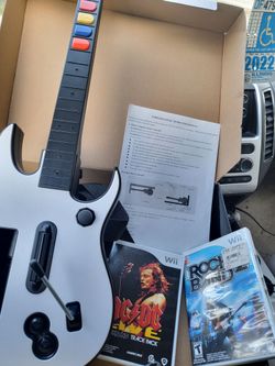 Nintendo wii Guitar hero and rockband guitar works for either Excellent Condition with 2 Games