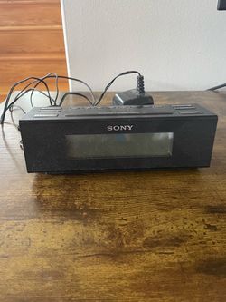 Handheld radio and alarm clock