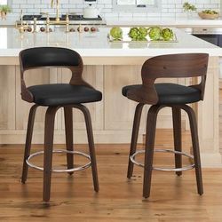 N31 $95  Black/Faux leather 26-in H Counter height Upholstered Swivel Wood Bar Stool 2 -Pack  Elevate your dining area, kitchen island, or home bar wi