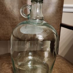 Empty heavy glass wine jug with finger ring on the neck. 
3L capacity. Last one available. Already washed clean.  Cash 💸 only, please. Front Door P/U