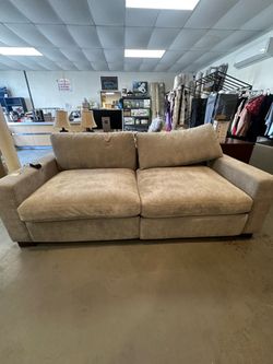 Light beige power reclining sofa
