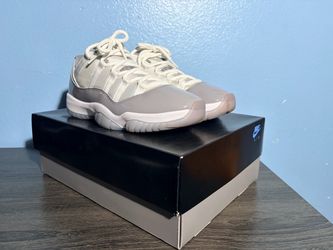 Jordan 11 low Cement Grey.