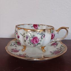 
Vintage White Bone China with Pink Flowers Tea Cup that has Feet and Matching Saucer Gold Trimmed