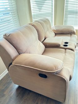 Loveseat with console: Tan, microfiber, manual double reclining loveseat with console.