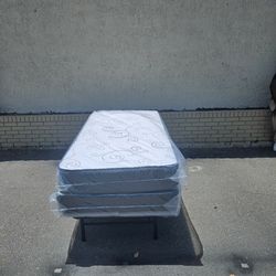 Brand new twin-size mattress and box spring in plastics