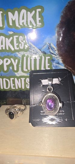 Silver ring and necklace charm