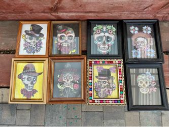 8 framed pieces of art featuring a Day of the Dead (Día de los Muertos) style sugar skull