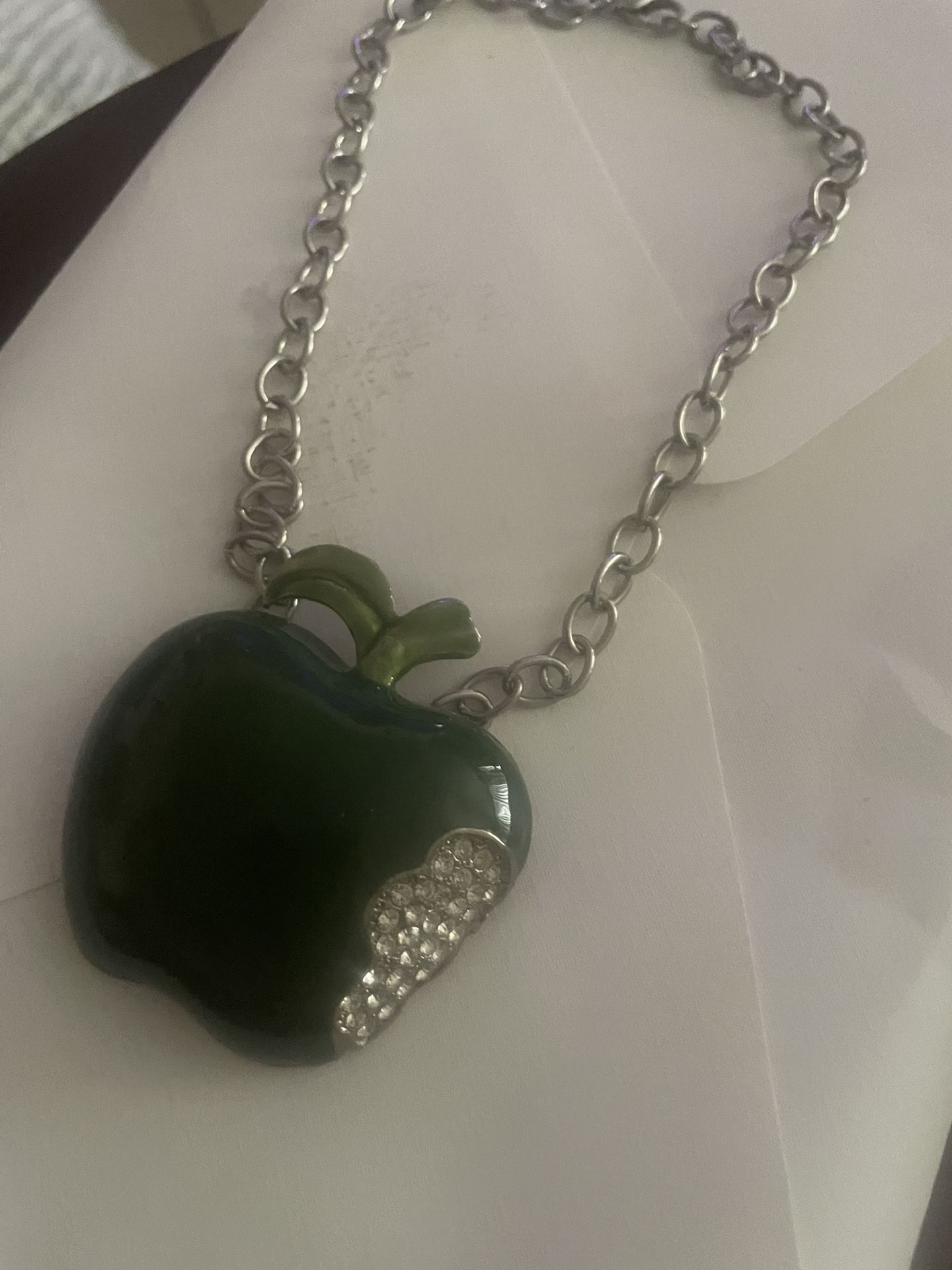 Apple. Necklace. $7. A bite out of the apple and clear gyms put in as seen in picture.
