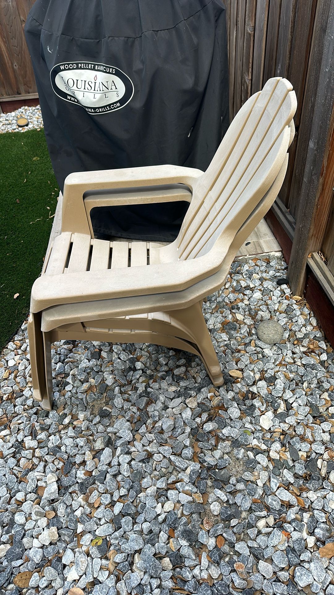 Two Tan Plastic Chairs