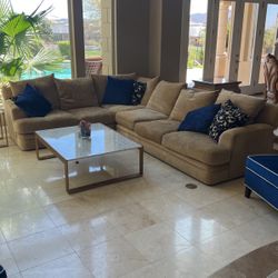 Huge Velvety beige L shaped sectional couch With accent color pillows.