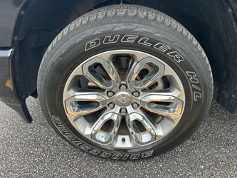 Factory RAM 1500 Chrome Wheels & Bridgestone Tires (Set of 4)