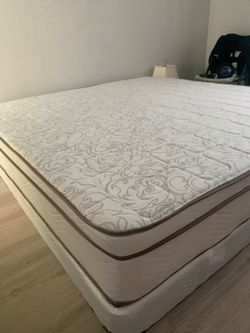 New king mattress and box springs bed frame is not included