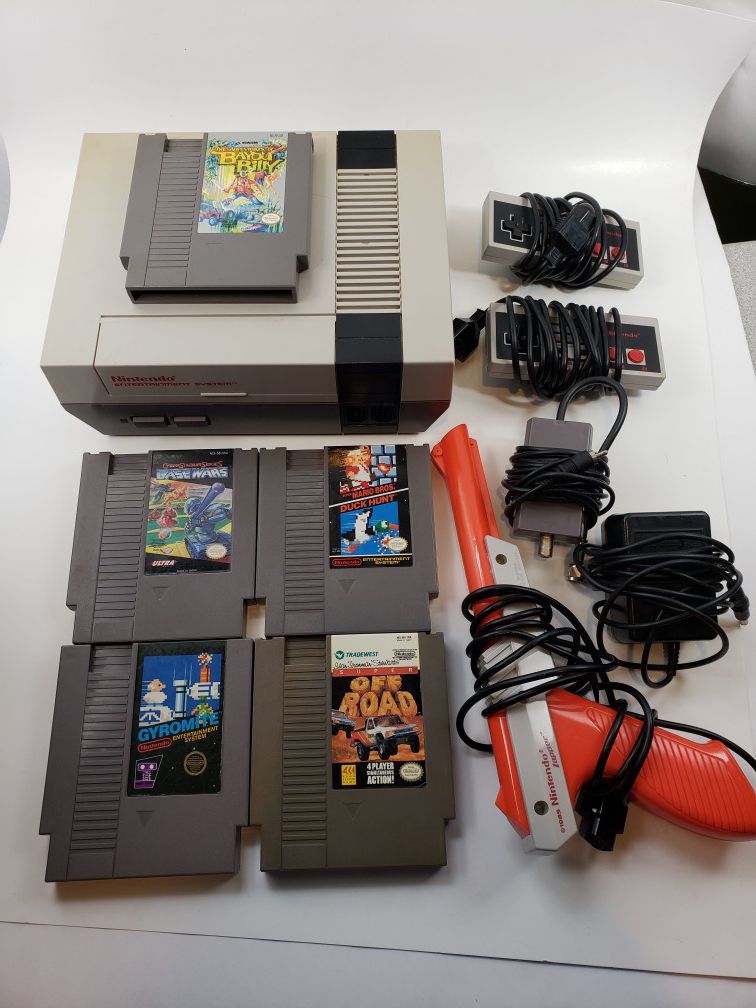 Original NES (Nintendo) with six games, 2 controllers, cords, and zapper. Works great.