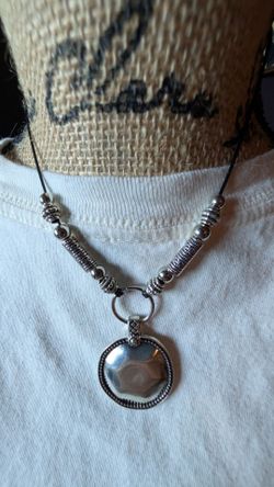 Bohemian shield style pendant with accents necklace