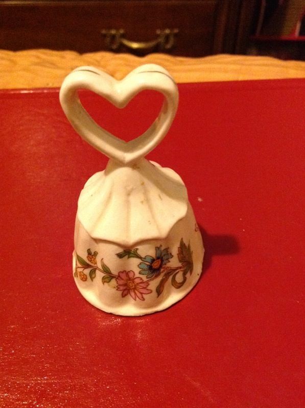 Ceramic bell with flowers and heart handle