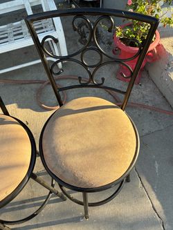 Black Metal Scroll-Back Chairs with Cushioned Seats