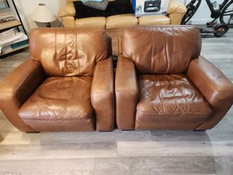 Set of two upholstered leather chairs