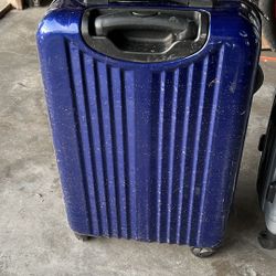 Suitcase Has Stickers On Other Side 