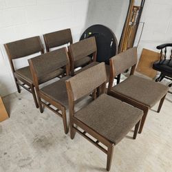 Set of 6 -mid-century modern teak dining chairs with brown upholstered seats. 