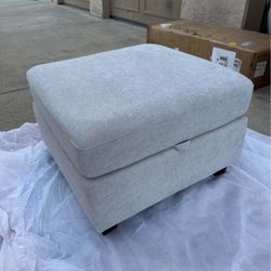 New quality, light gray, soft fabric, lift top storage ottoman 27” x 27”