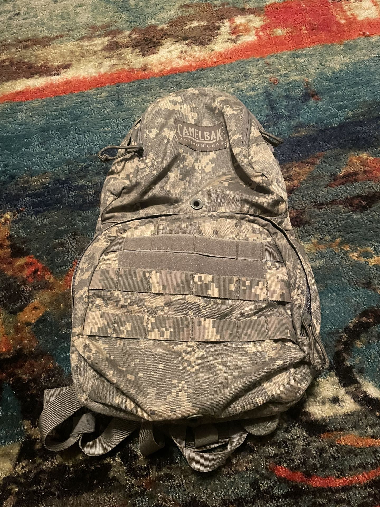 A CamelBak max gear M.U.L.E hydration backpack in camo, pack only.