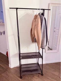 Rolling coat rack