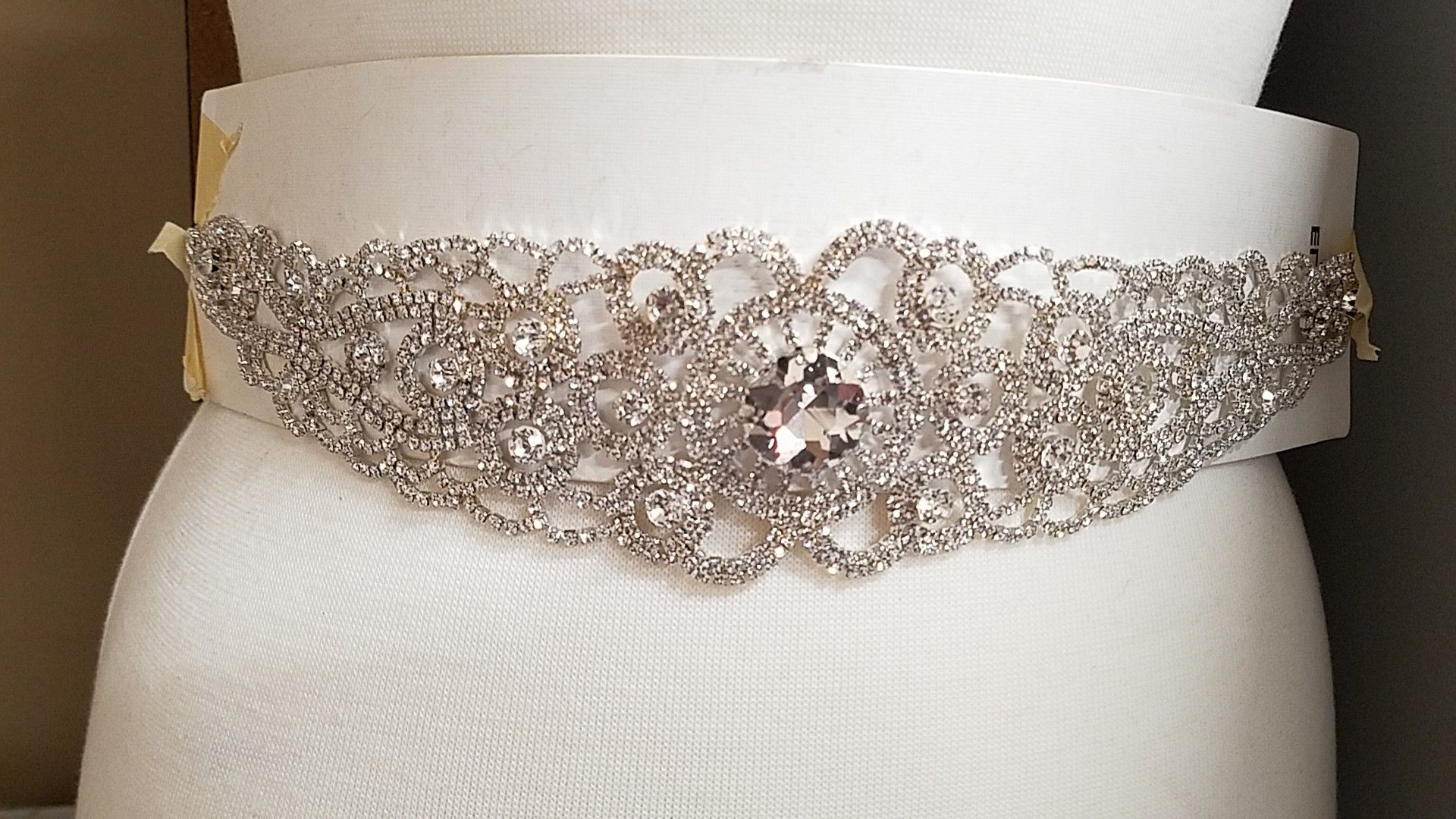 Gorgeous crystal belt with satin back to tighten it on ur waist (the white paper is just to hold it)