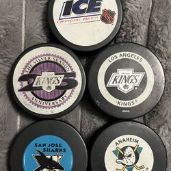 5 Used Hockey Pucks